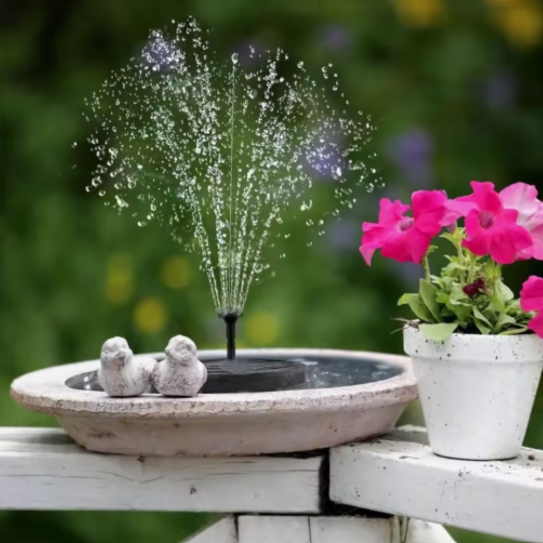 Sprinkler in a decorative bowl with a potted plant on a garden bench