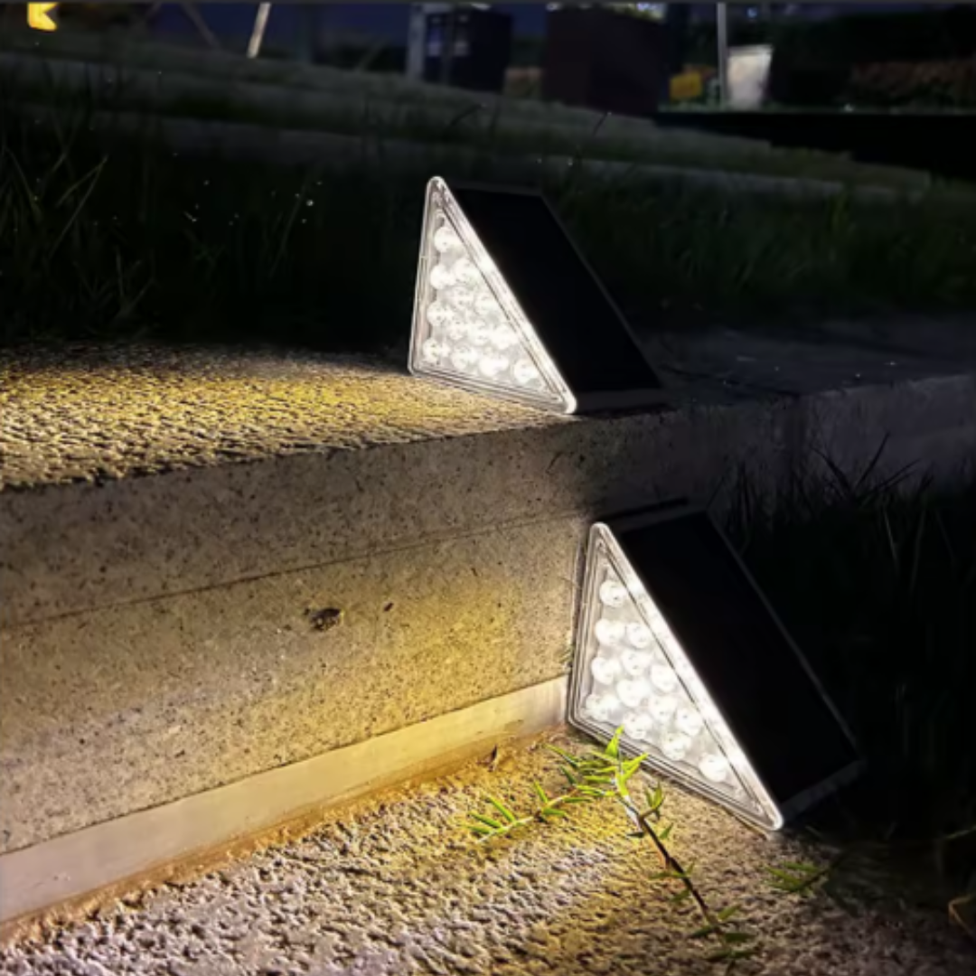 Front path at night with a single solar step light marking the level change
