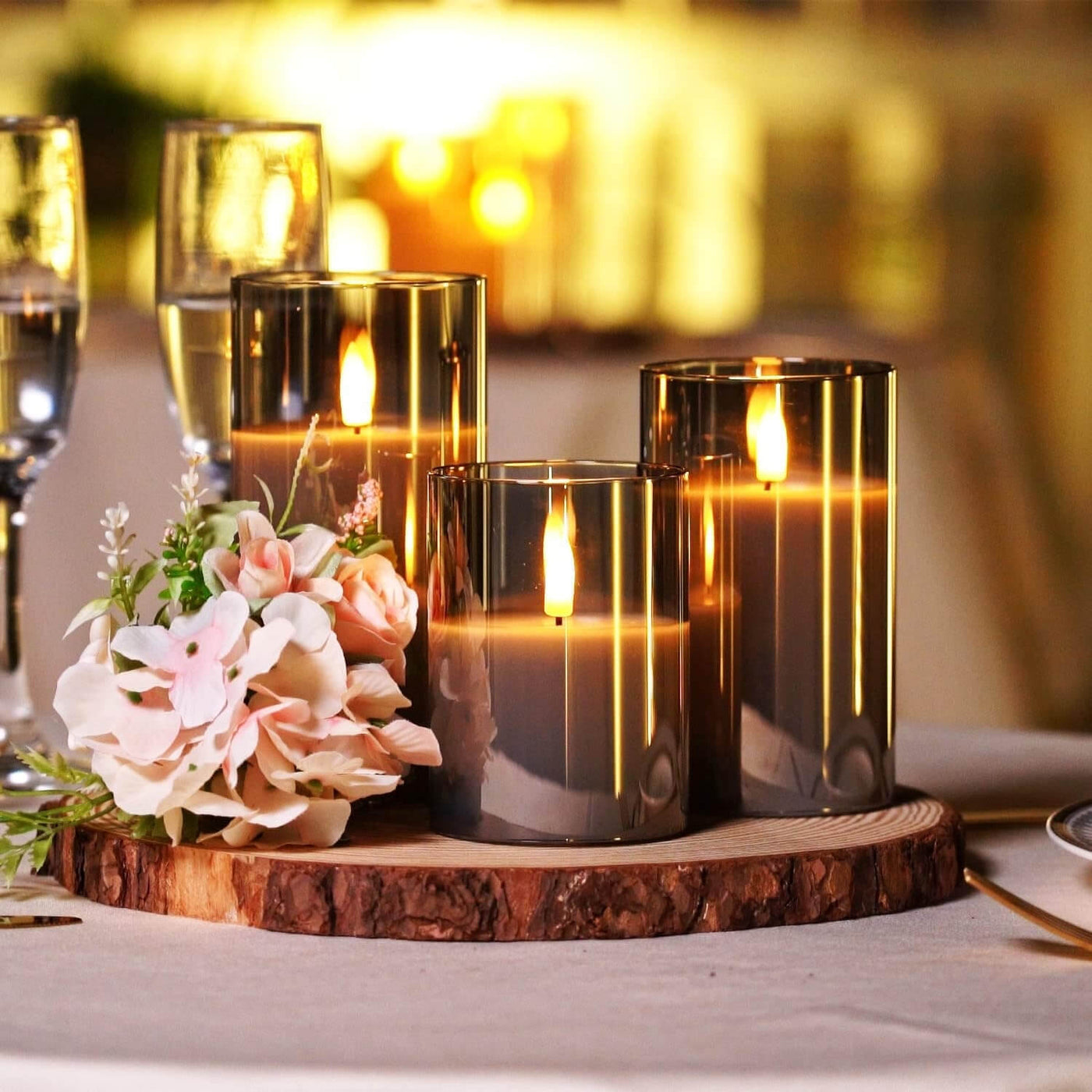Set of three flameless candles flickering on a mantelpiece