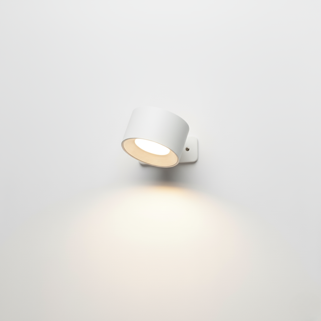 Wall light being rotated on its magnetic bracket to aim the beam