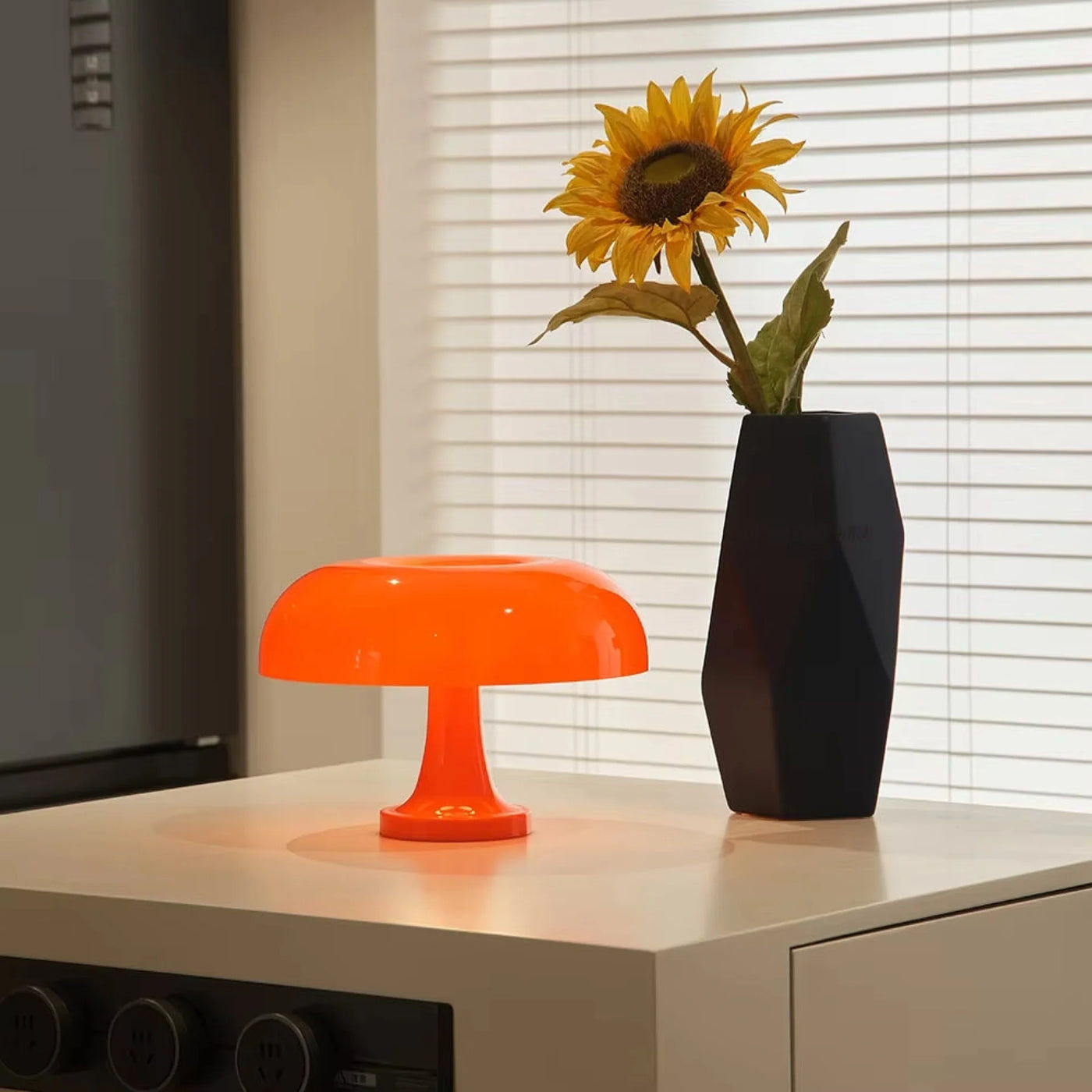 Touch control on a mushroom lamp switching between warm and cool light
