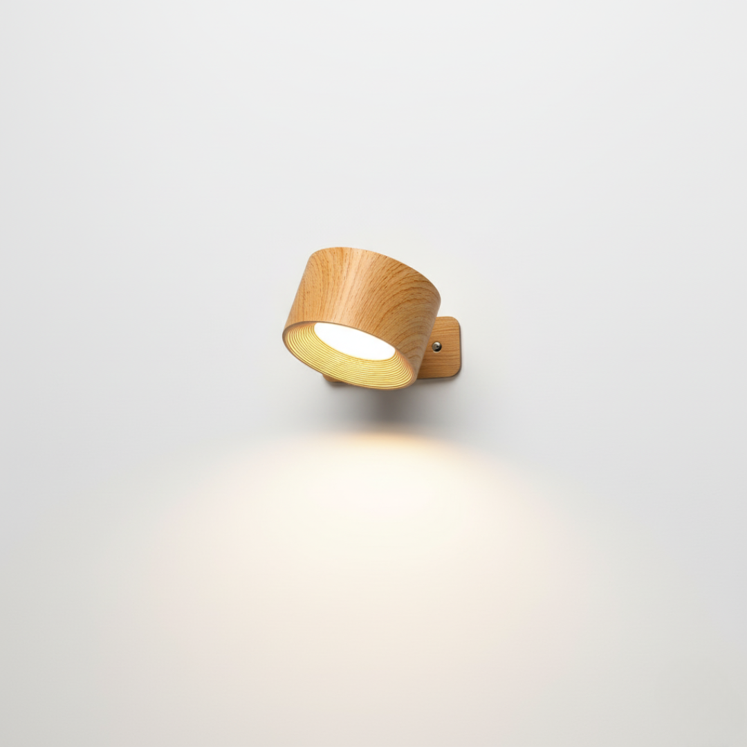 Top of a staircase lit by a compact magnetic wall light