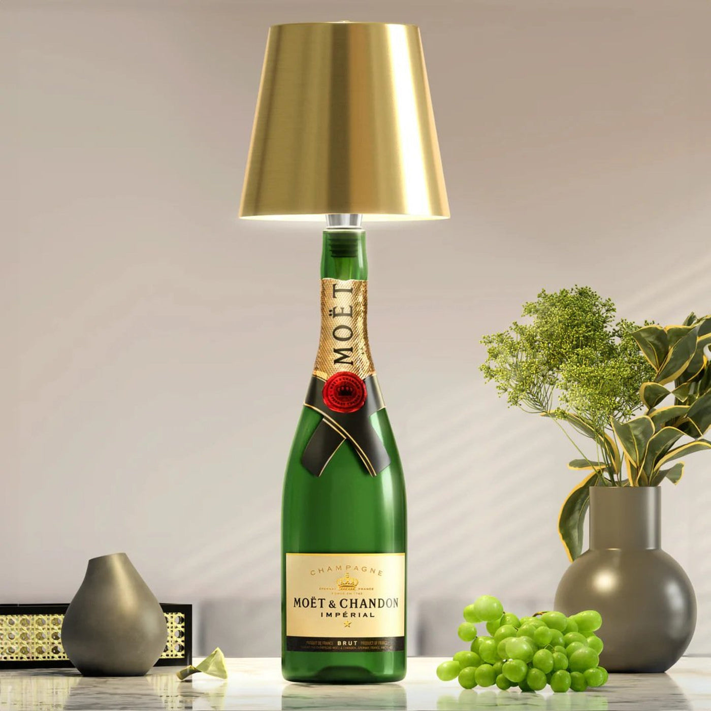 Three different bottles lit by the same ambient lamp base on a table