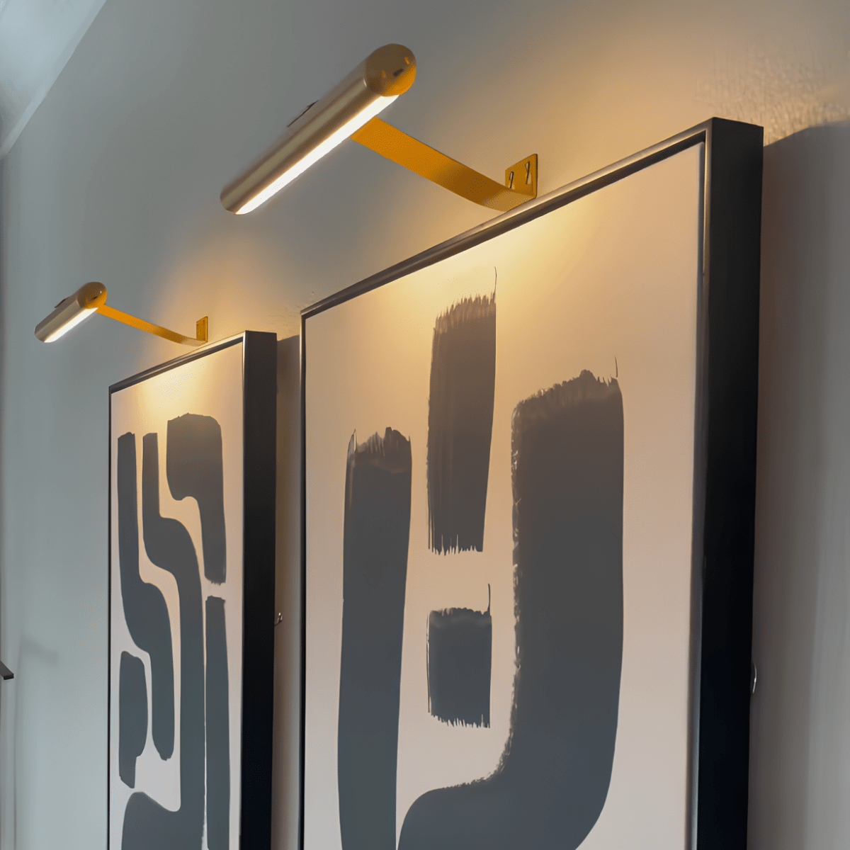 Slim aluminium picture light mounted above a frame with no visible cable